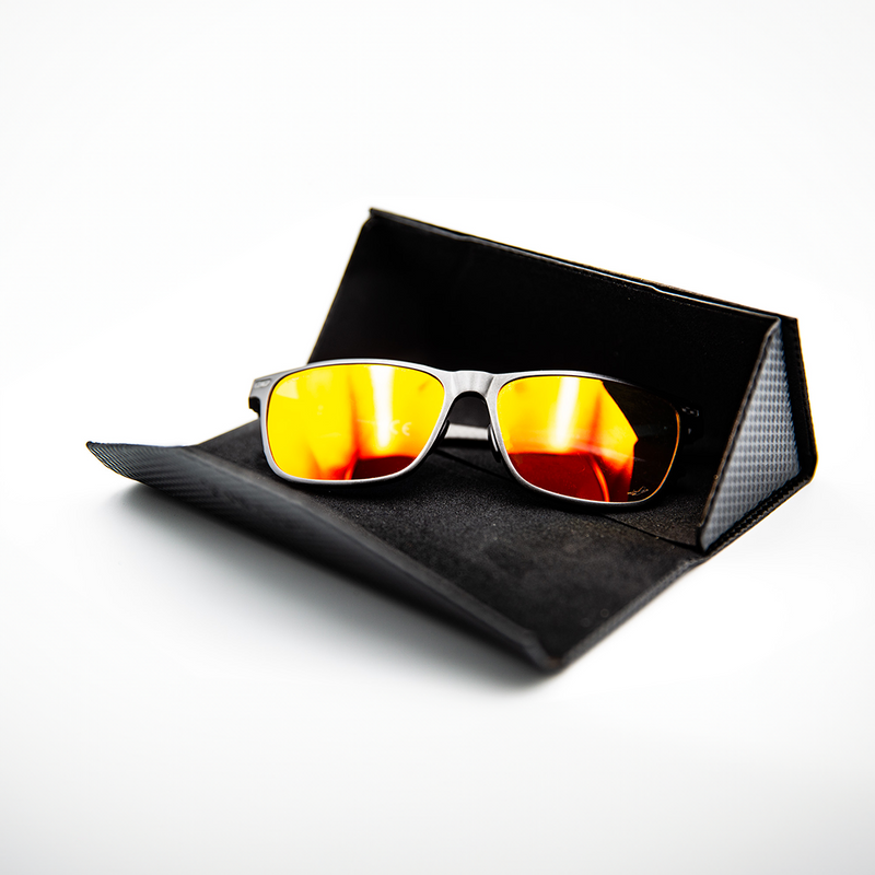 A pair of polarised pilots glasses, they are black with orange lenses. 