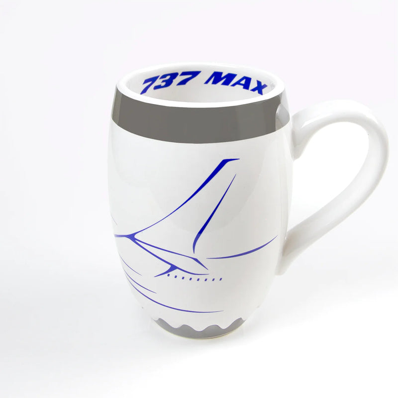 A white mug resembling an aircraft engine with the words 737 max on it.