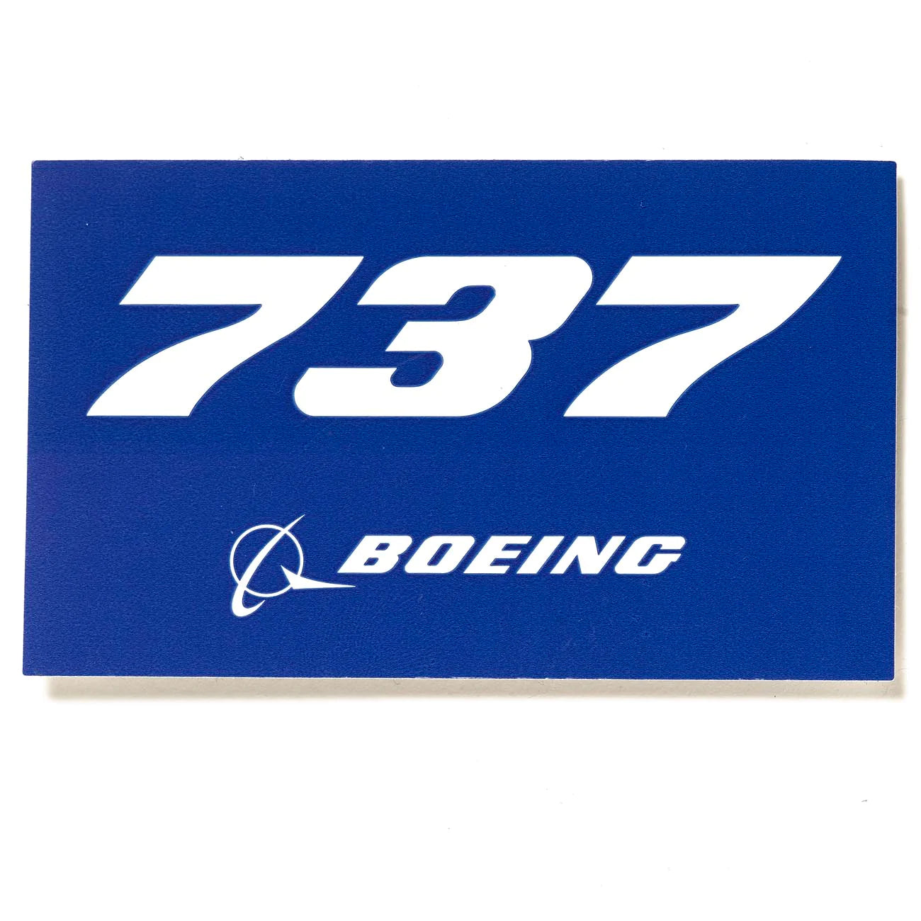 A blue sticker with Boeing 737 written on it.