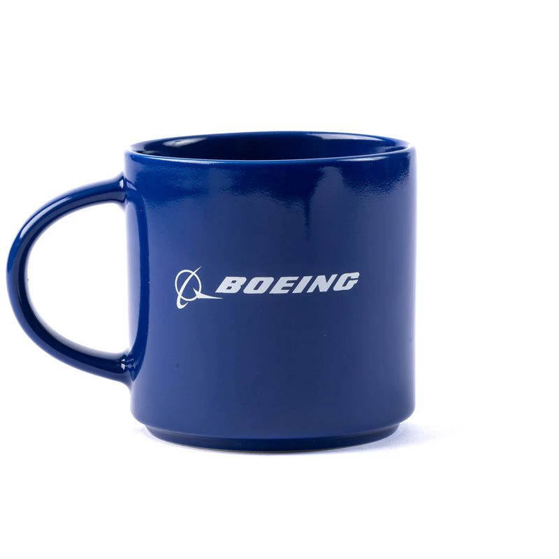 A blue mug with the Boeing logo on it.