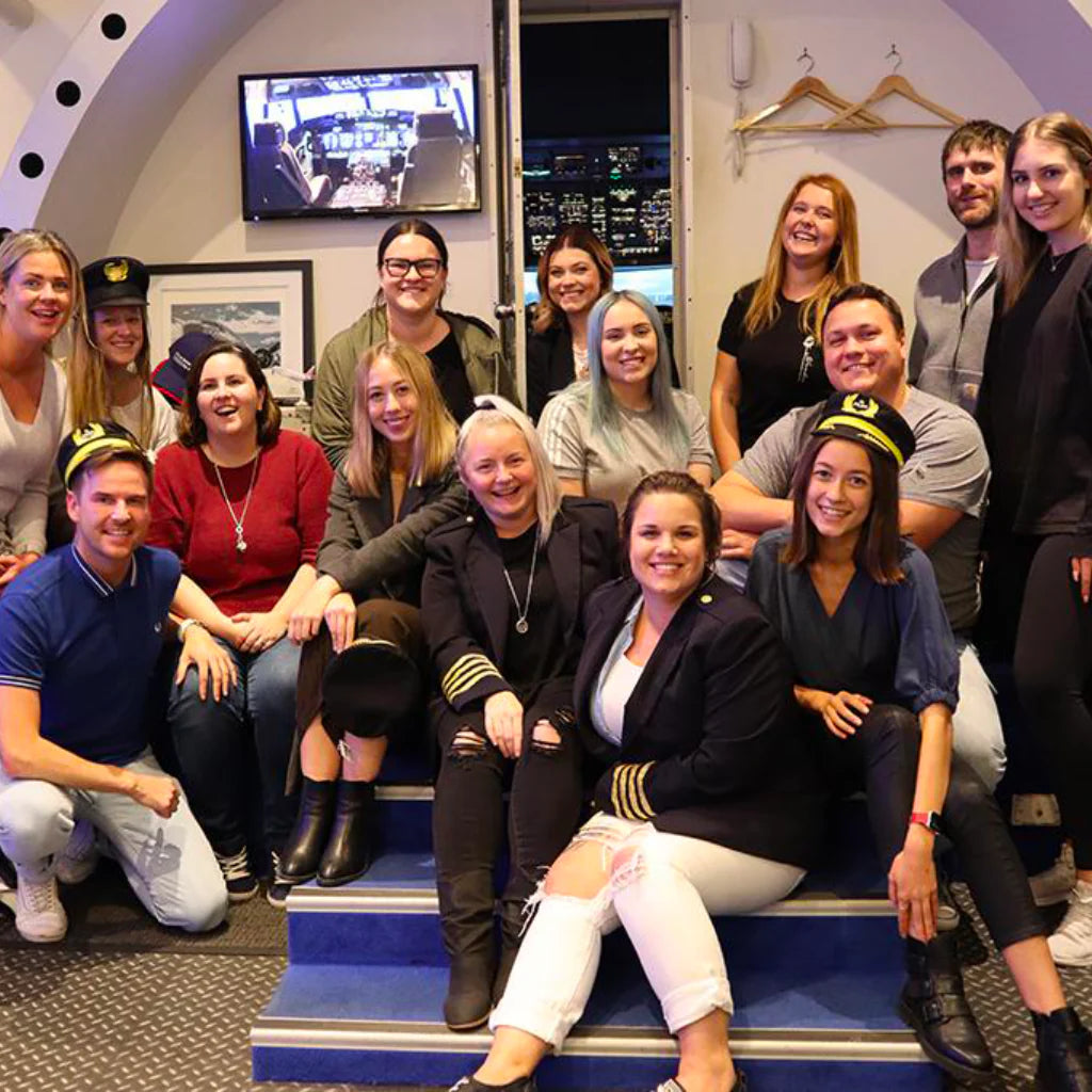 A group of people doing a group event at Flight Experience Perth.