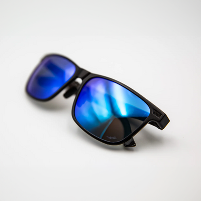 A pair of polarised pilots glasses, they are black with blue lenses.