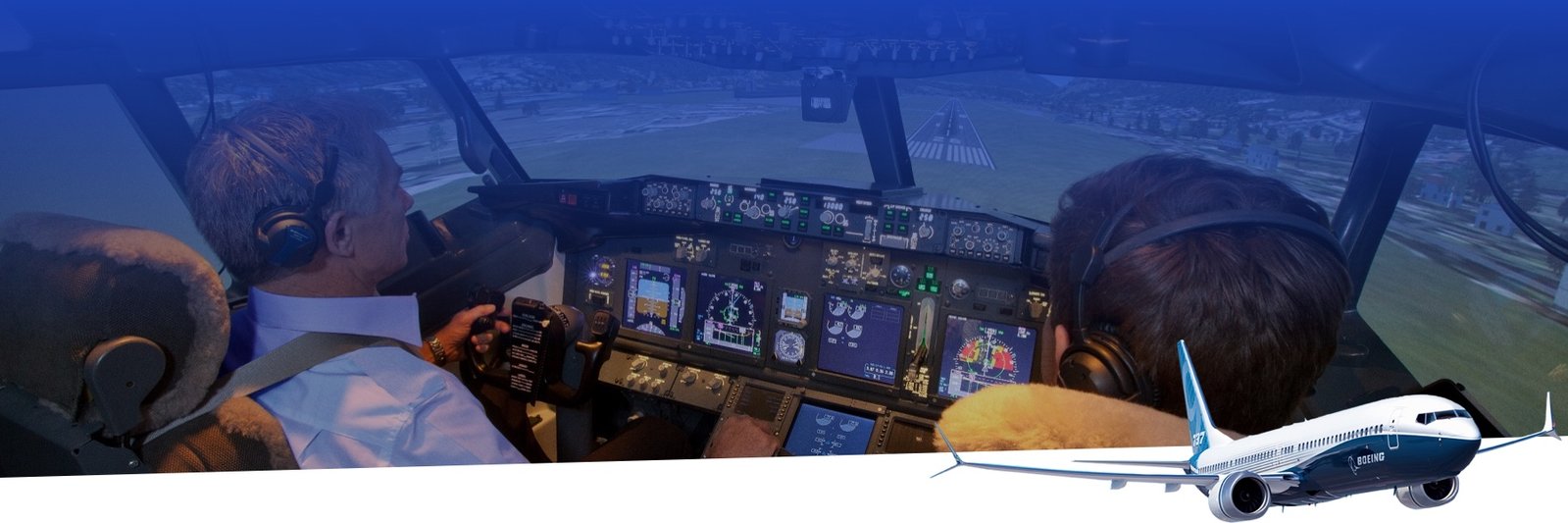 Two pilots controlling a flight simulator and are about to land.